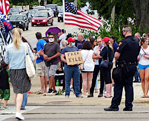 **FILE** A Kyle Rittenhouse supporter in Kenosha Wisconsin standing near Bradford High School hoping to get a glimpse of President Trump's motorcade on Sept. 1, 2020. (Lightburst via Wikimedia Commons)