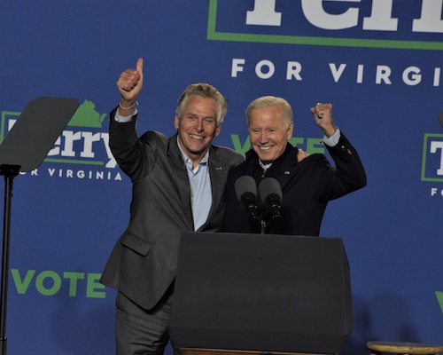 President Joe Biden (left) stands alongside Virginia Democratic gubernatorial hopeful Terry McAuliffe during a campaign rally in Arlington on Oct. 26. (Robert R. Roberts/The Washington Informer)