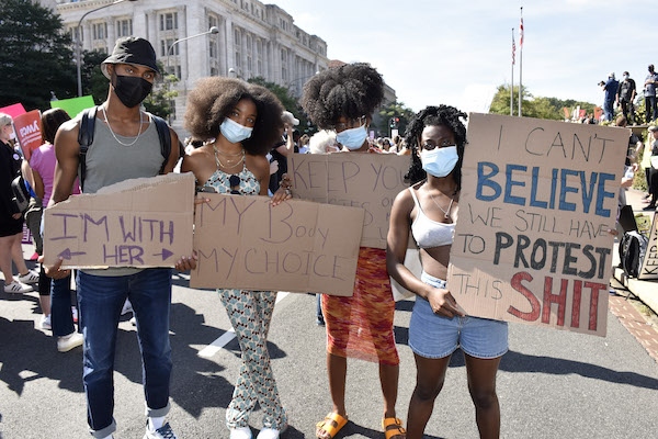 The 2021 Women's March held Oct. 2 in the District and in cities throughout the U.S. included celebrity guests and a message which focused on reproductive choice. Cristan Williams joined his friends Julian Hurp, Winter BreeAnne and Alexis Stewartson as they marched to the U.S. Supreme Court. (Rob Roberts/The Washington Informer)