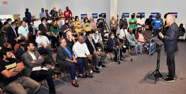 Maryland Comptroller and gubernatorial candidate Peter Franchot (right) speaks during the grand opening of his campaign headquarters in Bowie on Oct. 9. (Robert R. Roberts/The Washington Informer)