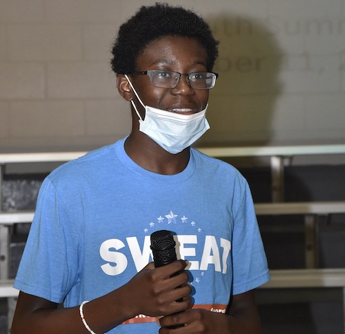 Oluwasemilore Adekanmi, 15, introduces a speaker Oct. 11 during a youth summit at Glenarden Community Center. (Robert R. Roberts/The Washington Informer)