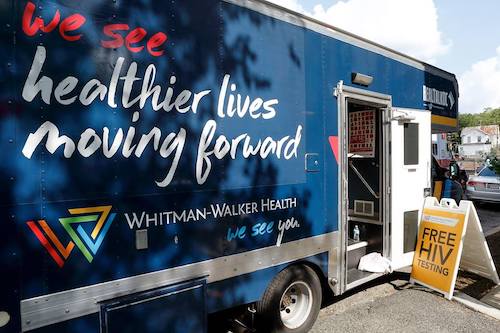 Whitman-Walker Health’s mobile HIV/STI testing van parked during a community outreach event (Courtesy of Whitman-Walker Health)