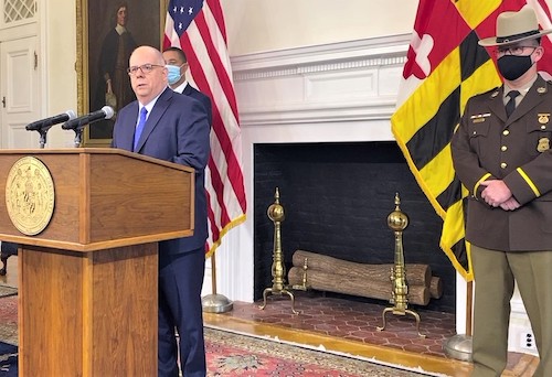 Maryland Gov. Larry Hogan speaks during a Nov. 23 press conference in Annapolis to announce proposed initiatives and emergency legislation to reduce violent crime, with an emphasis on Baltimore City. Standing alongside Hogan are Col. Jerry Jones (right), superintendent of the Maryland State Police, and chief legislative officer Keiffer Mitchell Jr. (William J. Ford/The Washington Informer)