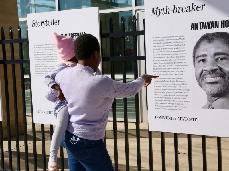 A family explores the community section which highlighted men of change from Deanwood during "Men of Change: Taking it to the Streets." (Courtesy of Smithsonian's Anacostia Community Museum)