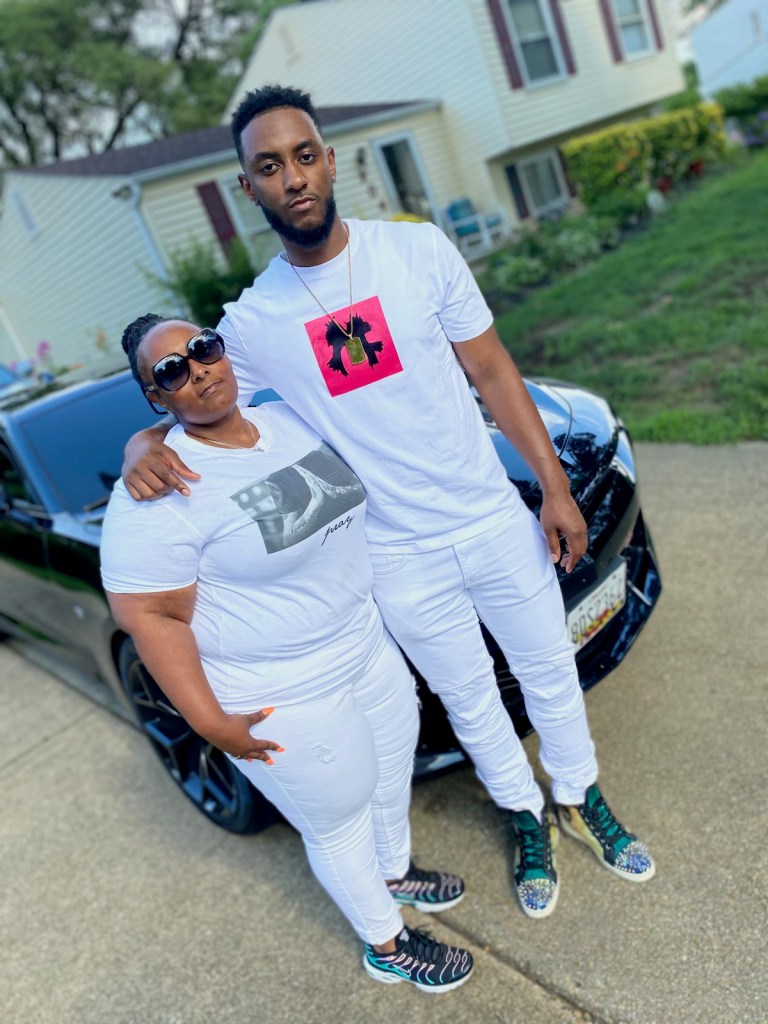 Letitia Newman with her son in front of his home