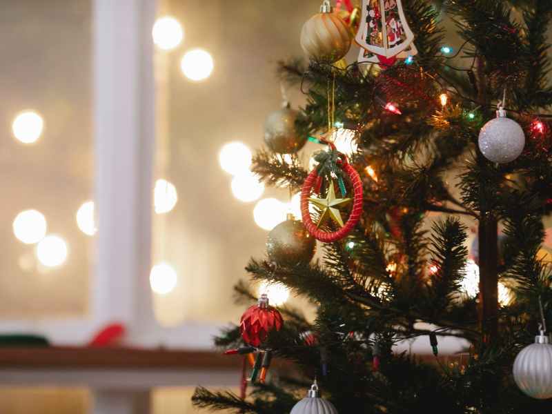 christmas tree decorated with baubles and garland