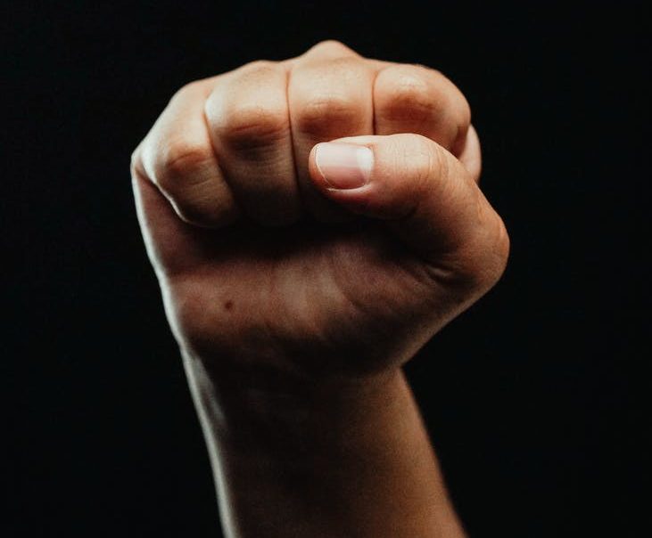 close up photo of a person clenching his fist