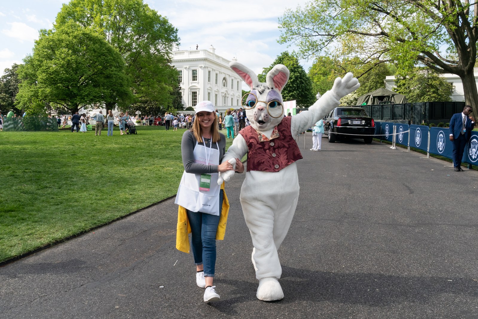 The Easter bunny walks with a volunteer on the South Lawn of the White House Monday, April 22, 2019, during the 141st White House Easter Egg Roll. (Official White House Photo by Andrea Hanks)