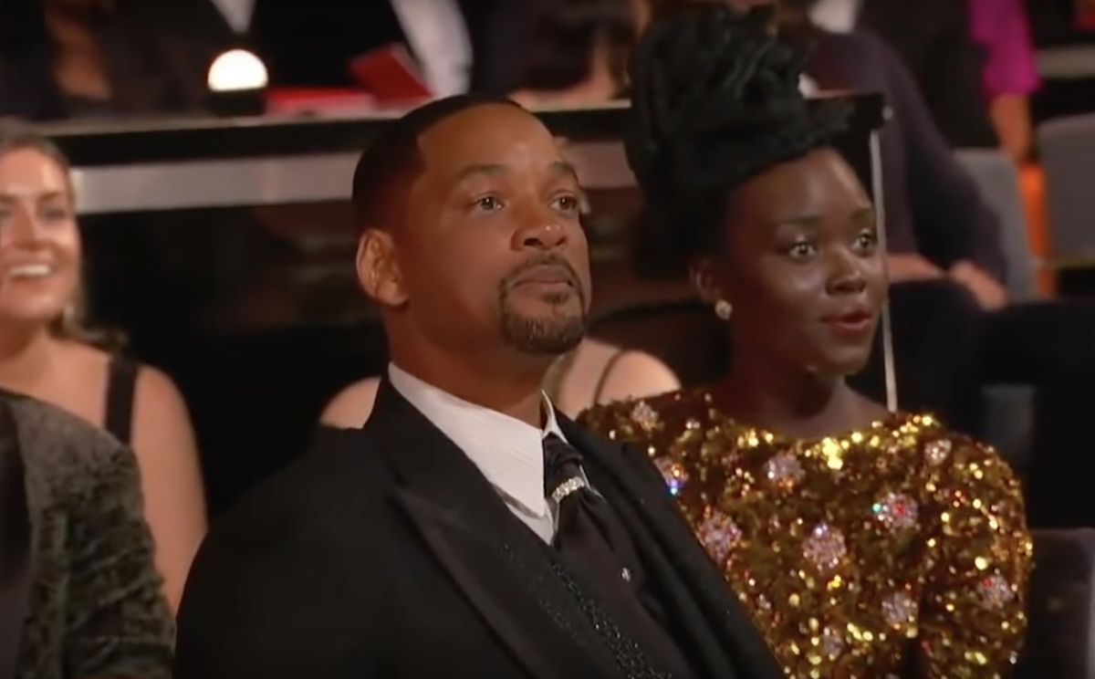 Will Smith yells at comedian Chris Rock (not pictured) from his front-row seat at the 2022 Oscars after taking the stage and slapping him for a joke about Smith's wife during the March 27 ceremony at the Dolby Theatre in Los Angeles.