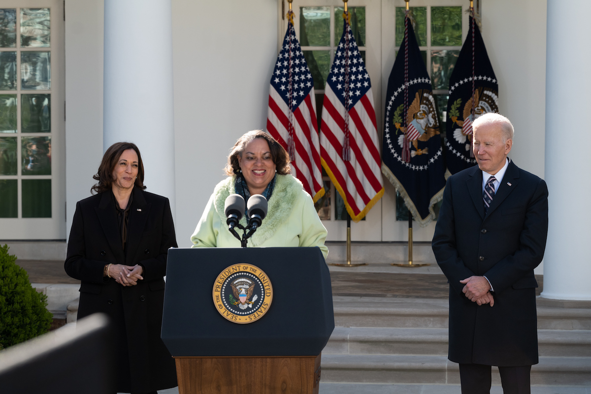 Michelle Duster, great-granddaughter of Ida B. Wells, stands with Vice President Kamala Harris (left) and President Joe Biden after Biden signed into law H.R. 55, the Emmett Till Anti-lynching Act, in the White House Rose Garden on March 29. (Cheriss May/The Washington Informer)