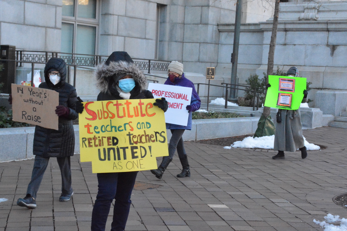 Substitute teachers who’ve taken on long-term assignments in schools where teachers have resigned continue to demand a wage increase and benefits. They began their weekly protests in front of the Wilson Building in January. (Roy Lewis/The Washington Informer)