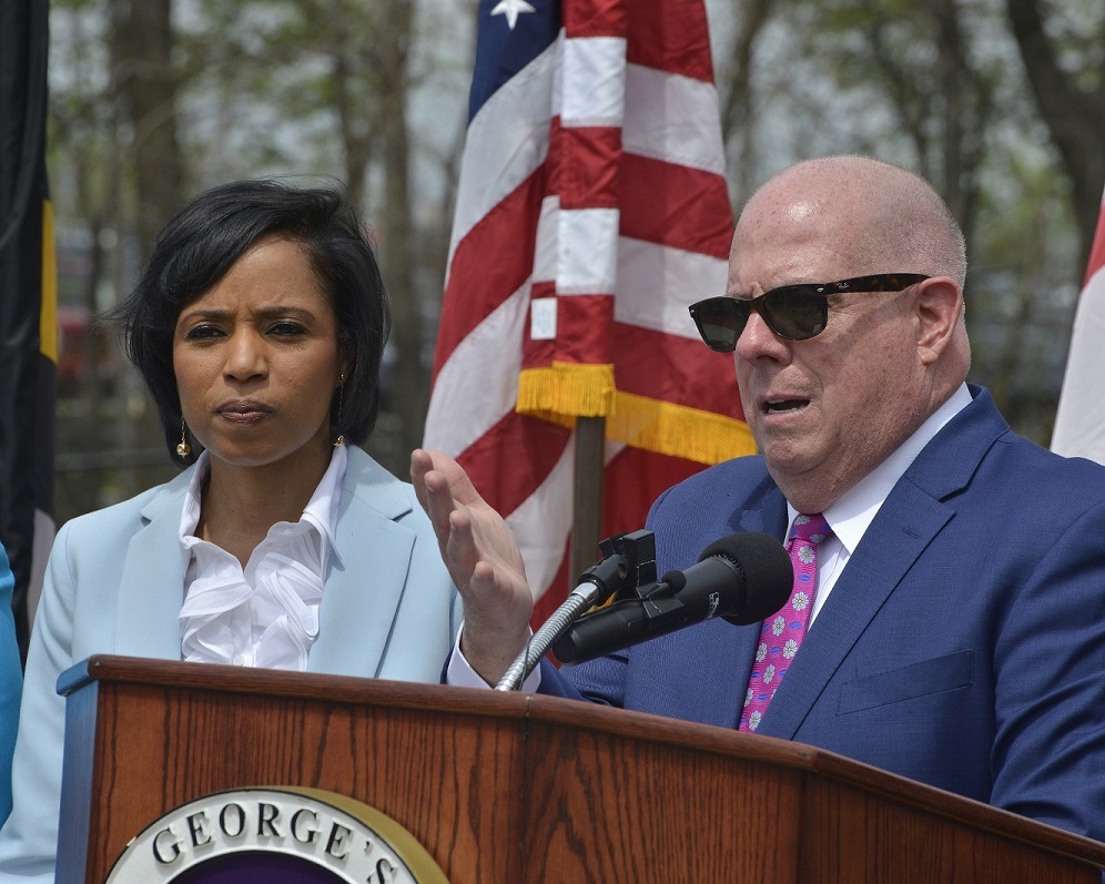 Maryland Gov. Larry Hogan speaks during an April 13 press conference at the Largo Town Center Metro station in support of $400 million economic development project along Metro’s Blue Line corridor in Prince George’s County as County Executive Angela Alsobrooks listens. (Robert R. Roberts/The Washington Informer)