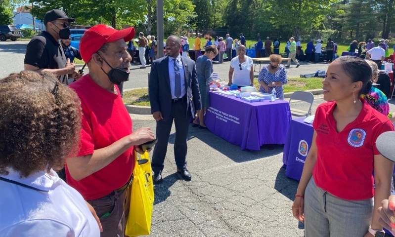Wayman Savoy (left) chats with Prince George's County Executive Angela Alsobrooks during an "Age My Way" senior information fair hosted by the county's Department of Family Services outside its Camp Springs headquarters on May 17. (William J. Ford/The Washington Informer)
