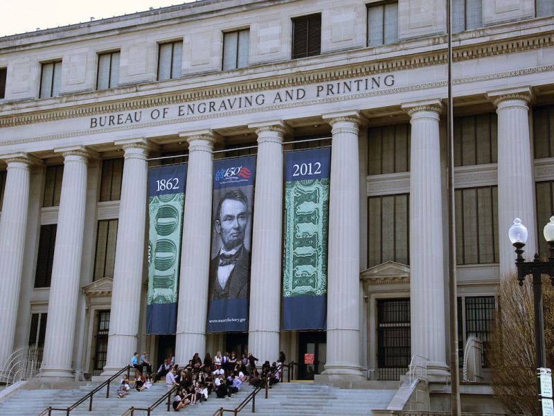 **FILE** The 15th Street SW entrance of the U.S. Bureau of Engraving and Printing building in Washington, D.C. ( Tim Evanson via Wikimedia Commons)
