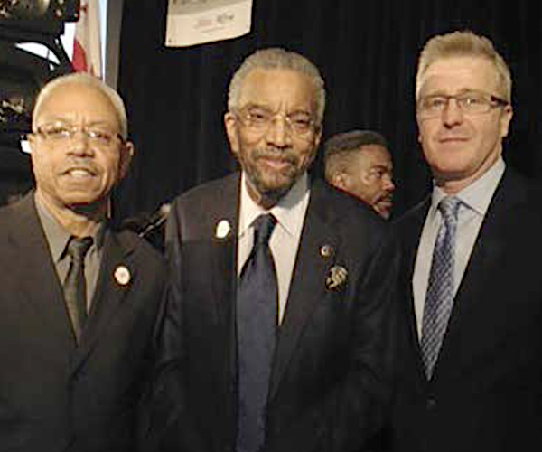 From left: Pictured in 2014, John Mercer, chairman of the board of directors, RAP, Inc.; Ron Clark; Michael Pickering, RAP, Inc. (Courtesy of RAP, Inc.)