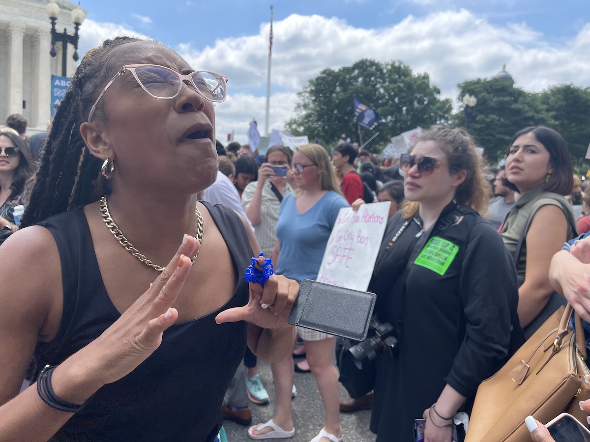 Demonstrators converge outside the Supreme Court building in D.C. on June 24 after it was announced that the court overturned Roe v. Wade. (Roy Lewis/The Washington Informer)