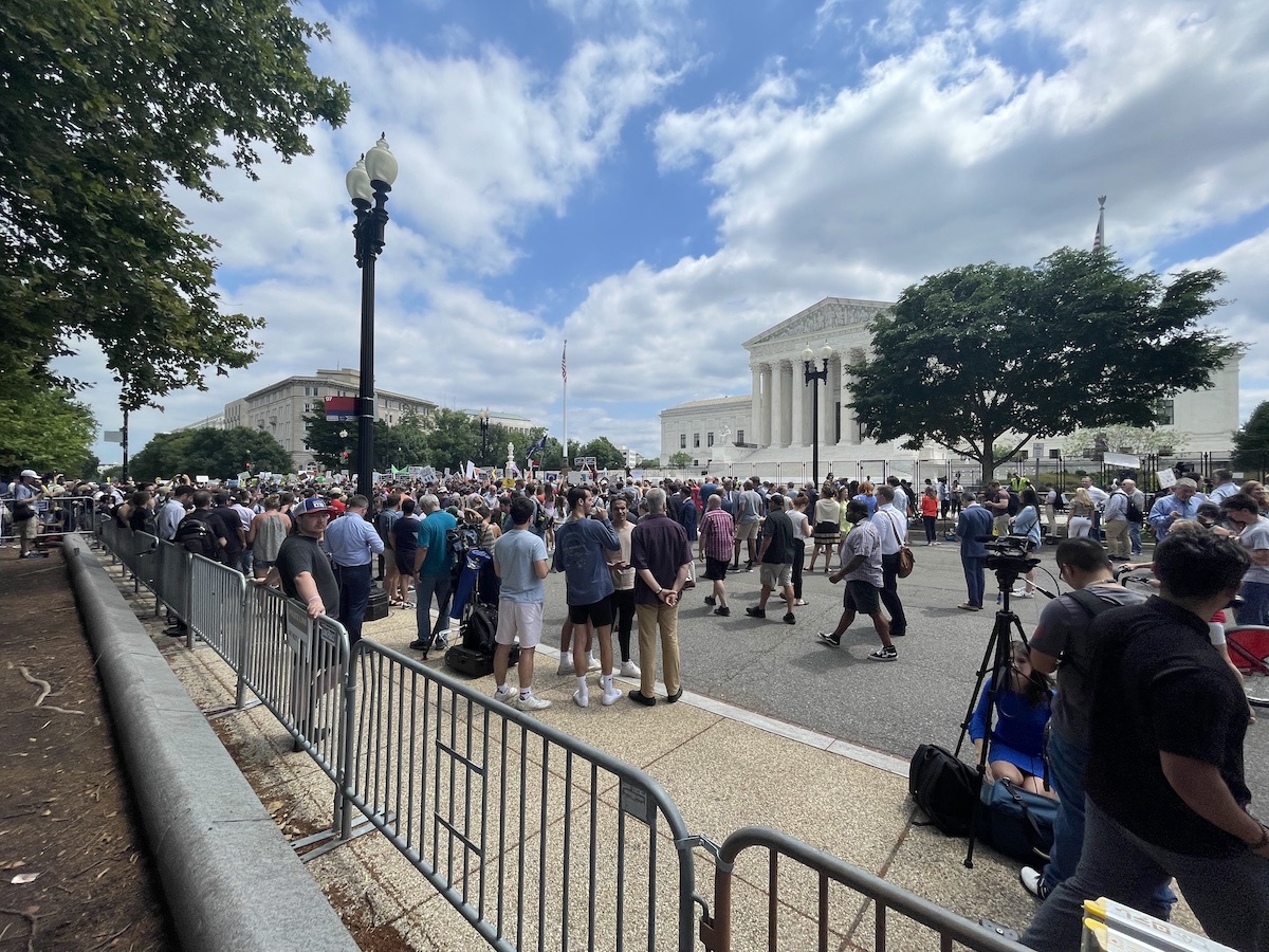 Demonstrators converge outside the Supreme Court building in D.C. on June 24 after it was announced that the court overturned Roe v. Wade. (Roy Lewis/The Washington Informer)