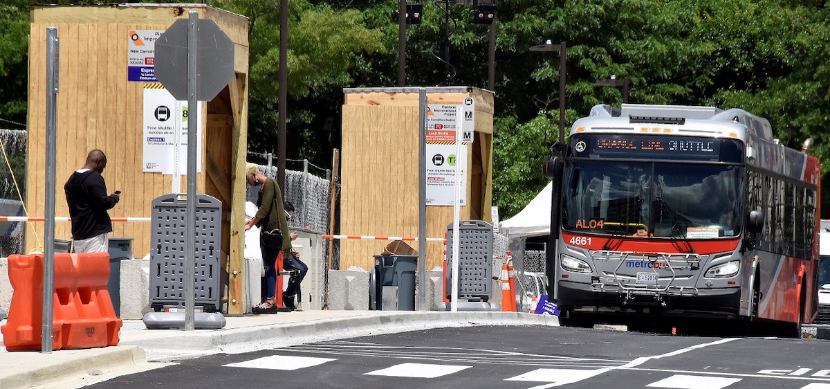A Metro shuttle bus is seen here at the New Carrollton Metro station on May 28. The free service will be provided for riders while platform work is conducted there and at four other Orange Line stations. (Robert R. Roberts/The Washington Informer)