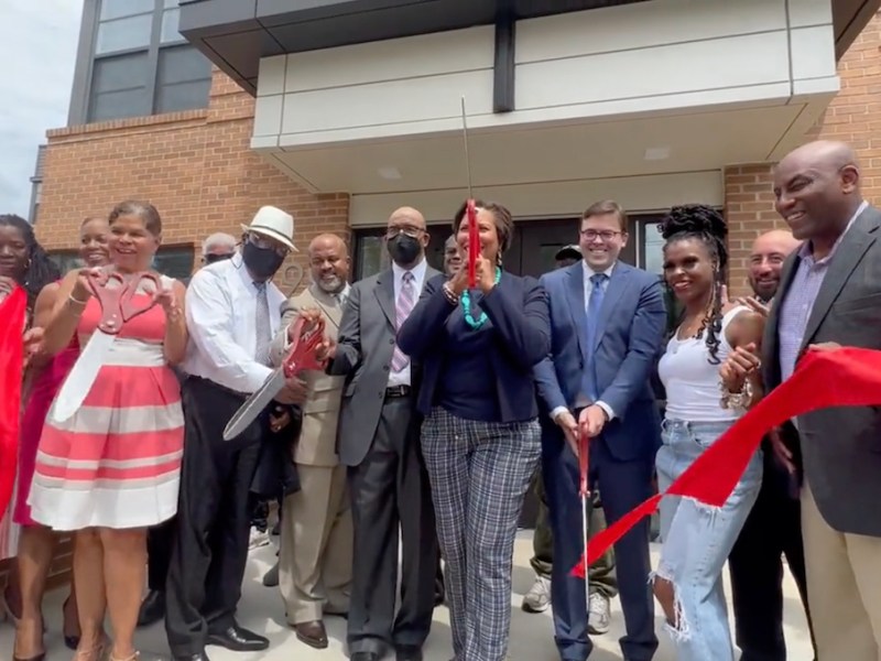 D.C. Mayor Muriel Bowser (center) presides over a ribbon-cutting ceremony for a new affordable housing community in Ward 7 on July 28.