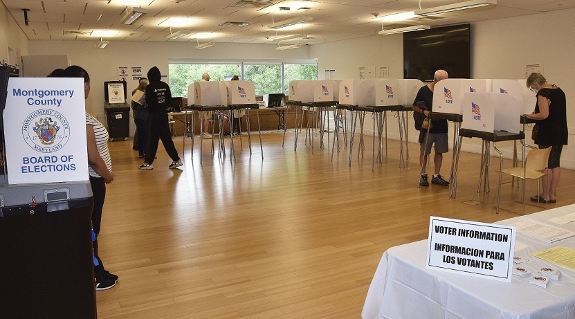 A handful of voters cast their ballots at the Silver Spring Civic Building in Silver Spring, Maryland, on July 7, the first day of the early voting period for the state's primary election. (Robert R. Roberts/The Washington Informer)