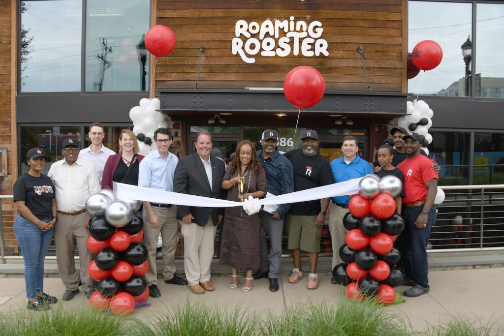 Roaming Rooster is a family-owned business. At the Skyland area location in Ward 7 are (from left) owners Michael Habtemariam, his sister-in-law, Hareg Mesfin, and Michael’s brother, Biniyam Habtemariam. (Anthony Tilghman/The Washington Informer)
