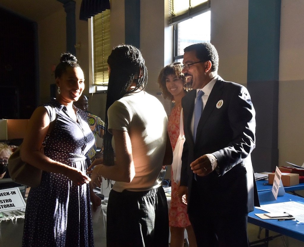 Maryland Democrat and gubernatorial candidate John King Jr. celebrates with wife and their two daughters after voting on Election Day on July 19. King’s daughter, Amina, second from right, voted for the first time. (Robert R. Roberts/The Washington Informer)