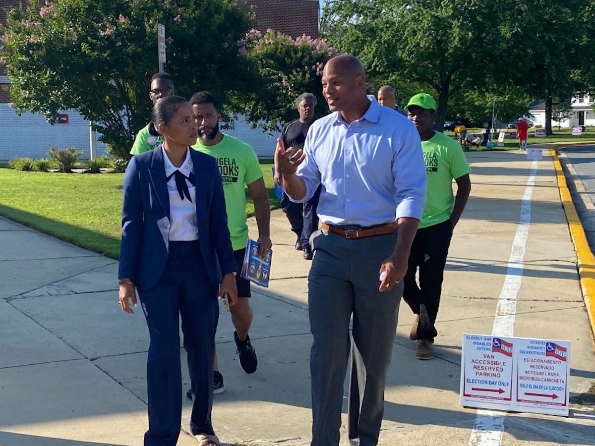 Maryland Democrat and gubernatorial candidate Wes Moore, right, walks with Prince George’s County Executive Angela Alsobrooks on Election Day on July 19 outside Potomac Landing Elementary School in Fort Washington. (William J. Ford/The Washington Informer)