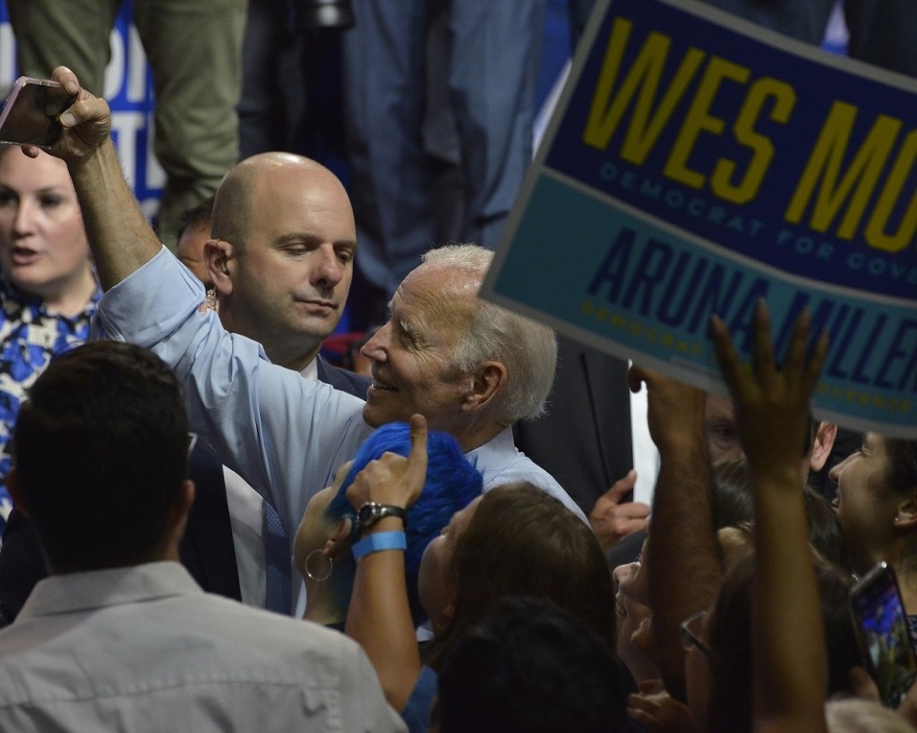 President Joe Biden takes selfies with supporters after speaking during a Democratic Party rally at Richard Montgomery High School in Rockville, Maryland, on Aug. 25. (Robert R. Roberts/The Washington Informer)