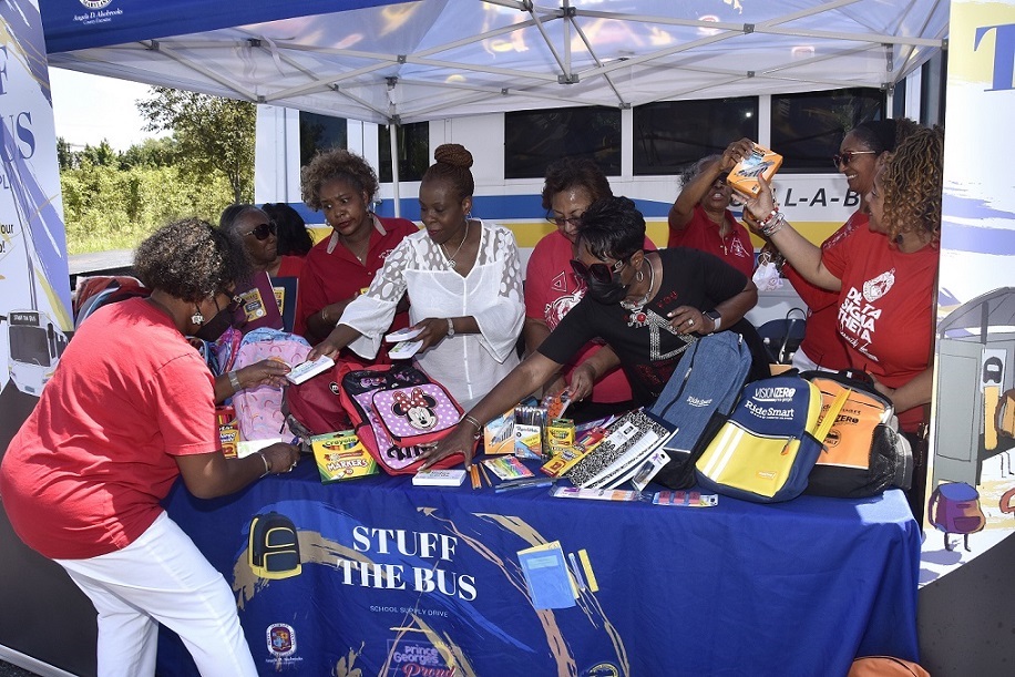 Members of Delta Sigma Theta Sorority Inc. donate pens, pencils, markers and other school supplies for Prince George’s County Public Schools students on Aug. 12. The county’s Department of Public Works and Transportation conducted its annual “Stuff TheBus” back-to-school supply drive that ran from July 22 to Aug. 15. (Robert R. Roberts/The Washington Informer)