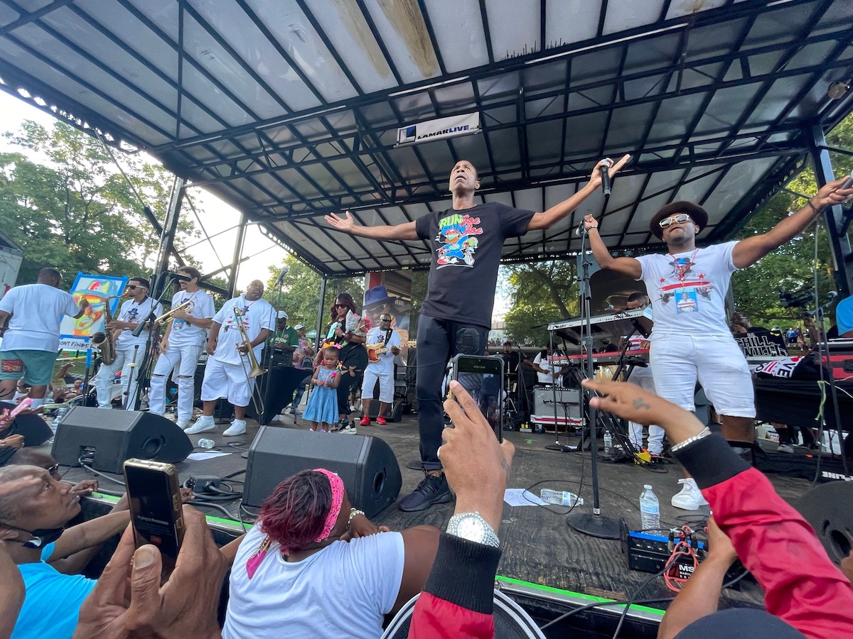 Chuck Brown’s youngest son, Wiley Brown (right) of the Chuck Brown Band, performs with Doug E. Fresh on Chuck Brown Day at Chuck Brown Park in northeast D.C. on Aug. 20. (Roy Lewis/The Washington Informer)