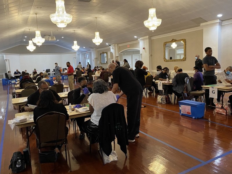 Election workers at the Prince George’s County Ballroom in Landover recount ballots on Aug. 22 for the legislative District 23 race that separated the third and final spot winner and fourth-place finisher by 19 votes. (William J. Ford/The Washington Informer)