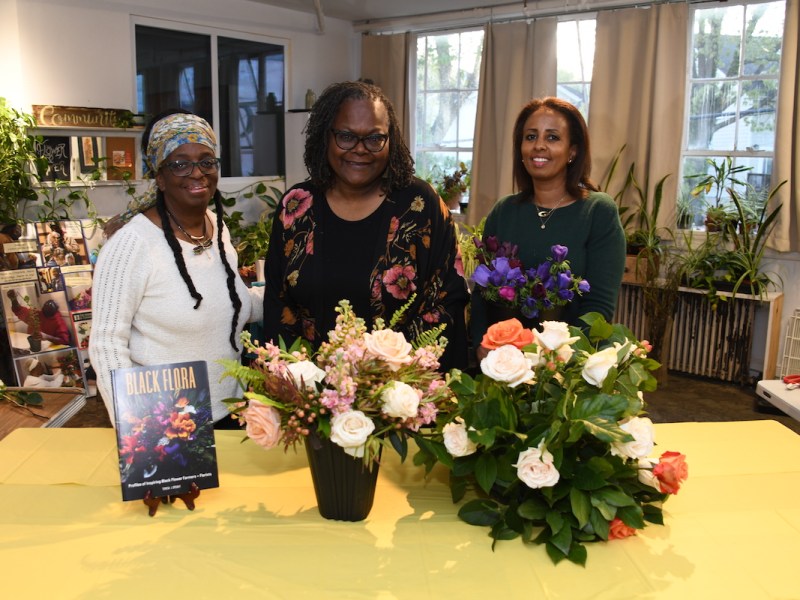 Featured in “Black Flora” are D.C.-area floral creatives (from left) Kaifa Anderson-Hall, a horticultural therapist in northeast D.C., author Teri Speight and Hermon Black, a floral designer in Arlington, Va., pictured here at Plants and Blooms, Anderson-Hall’s studio. (Anthony Tilghman/The Washington Informer)