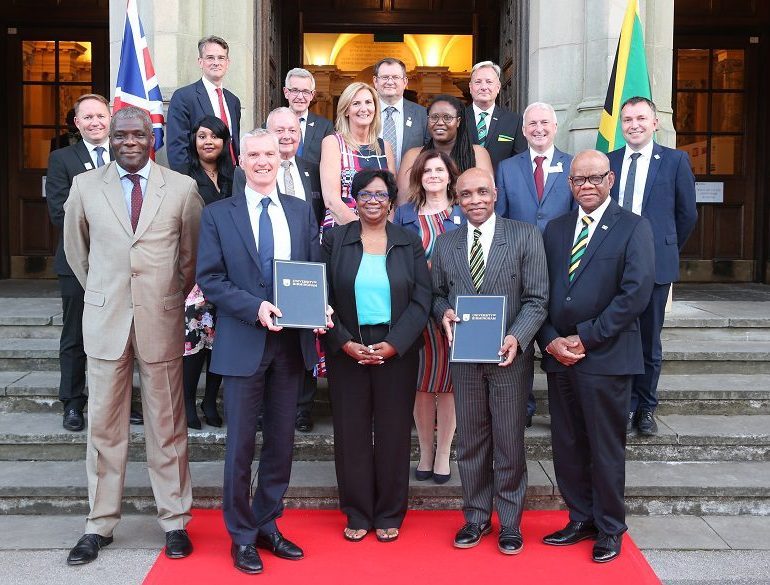 Members of the signing party including (front row, 2nd left) Professor Tim Jones, Provost and Vice Principal of the University of Birmingham; JOA First Vice-President Jacqueline Cowan (center); JOA President Christopher Samuda (2nd right); and His Excellency Seth George Ramocan, High Commissioner to London. (Courtesy photo)