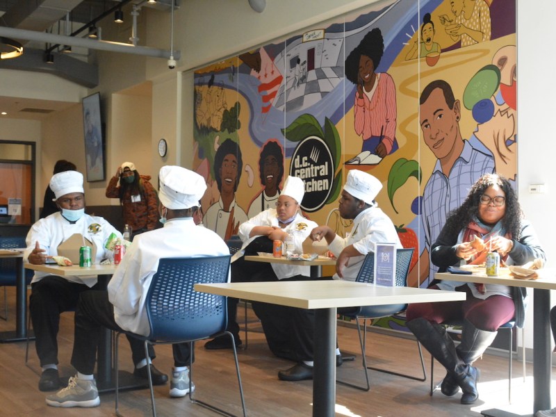**FILE** Students from Ballou High School eating a meal (Roy Lewis/The Washington Informer)