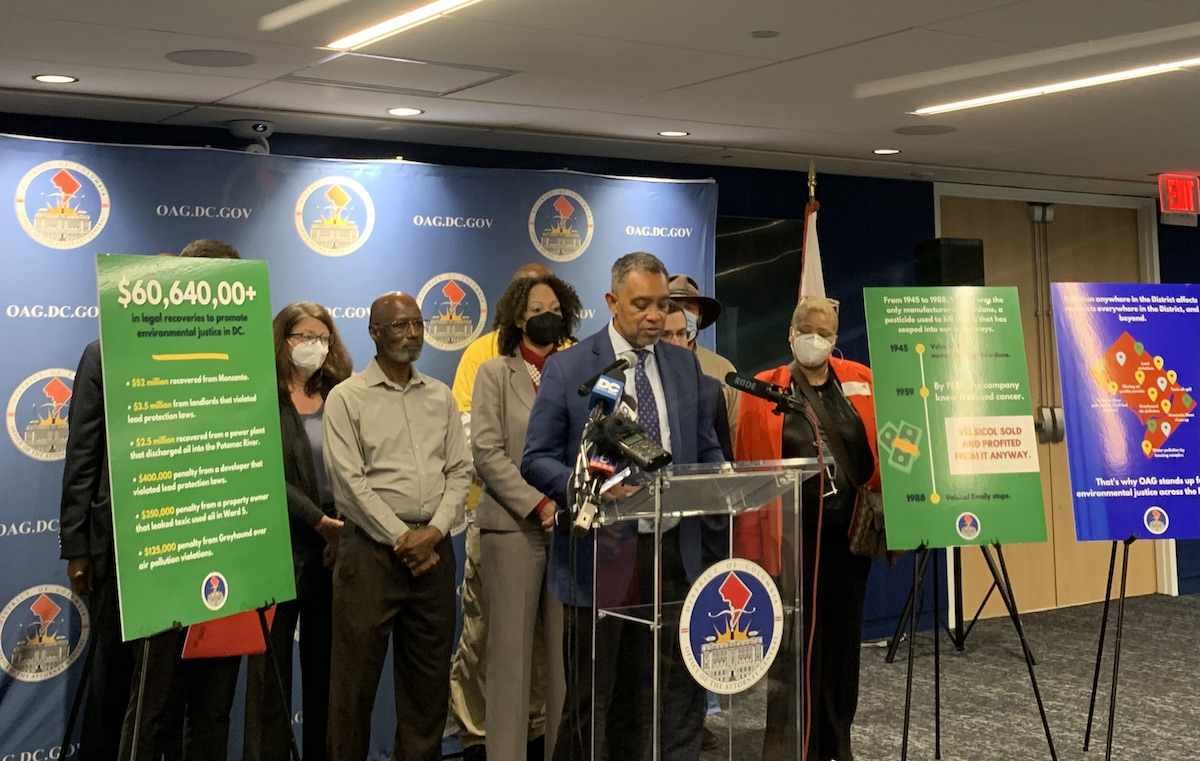 D.C. Attorney General Karl Racine (at podium) announces a lawsuit against chemical manufacturer Velsicol during a press conference on Oct. 13. Environmental justice advocates from NAACP DC, the Sierra Club and Groundwork Anacostia River DC also spoke in support of the suit.