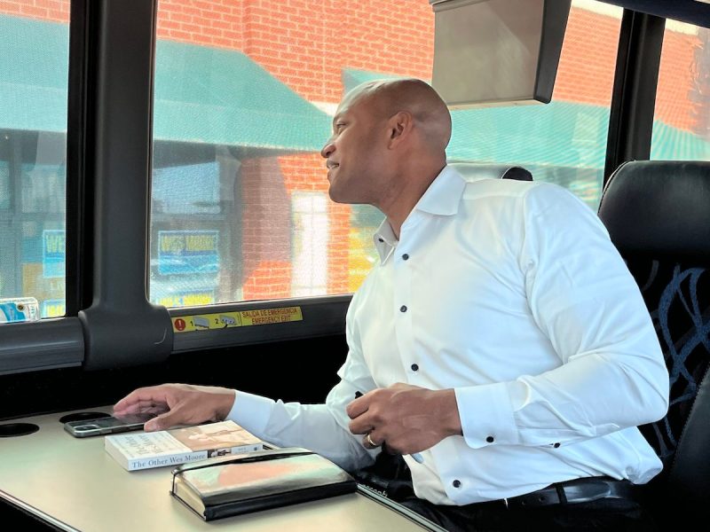 Democratic gubernatorial candidate Wes Moore looks out the window of his campaign tour bus on day five of his weekslong tour. The 45-foot long bus is driving Moore and his staff across Maryland leading up to Election Day (Shannon Clark/Capital News Service)