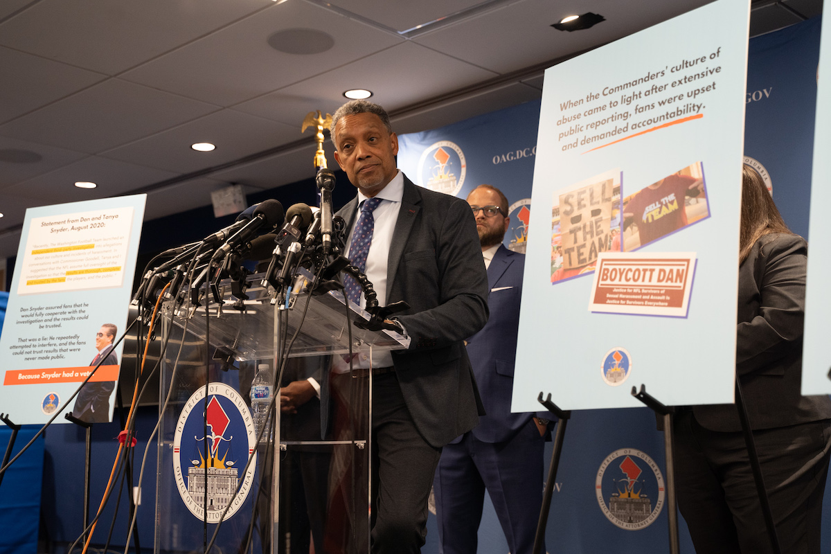 D.C. Attorney General Karl Racine announces during a Nov. 10 press conference in Northwest that his office has filed a consumer-protection civil lawsuit against the Washington Commanders, team owner Dan Snyder, the NFL and league Commissioner Roger Goodell. (Marckell Williams/The Washington Informer)