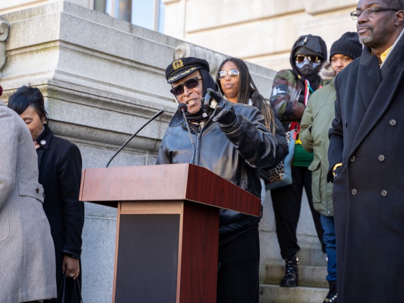 Roach Brown speaks in front of the John A. Wilson Building in D.C. during the Emergency Rally for Returning Citizens on Dec. 19. (Marckell Williams/The Washington Informer)