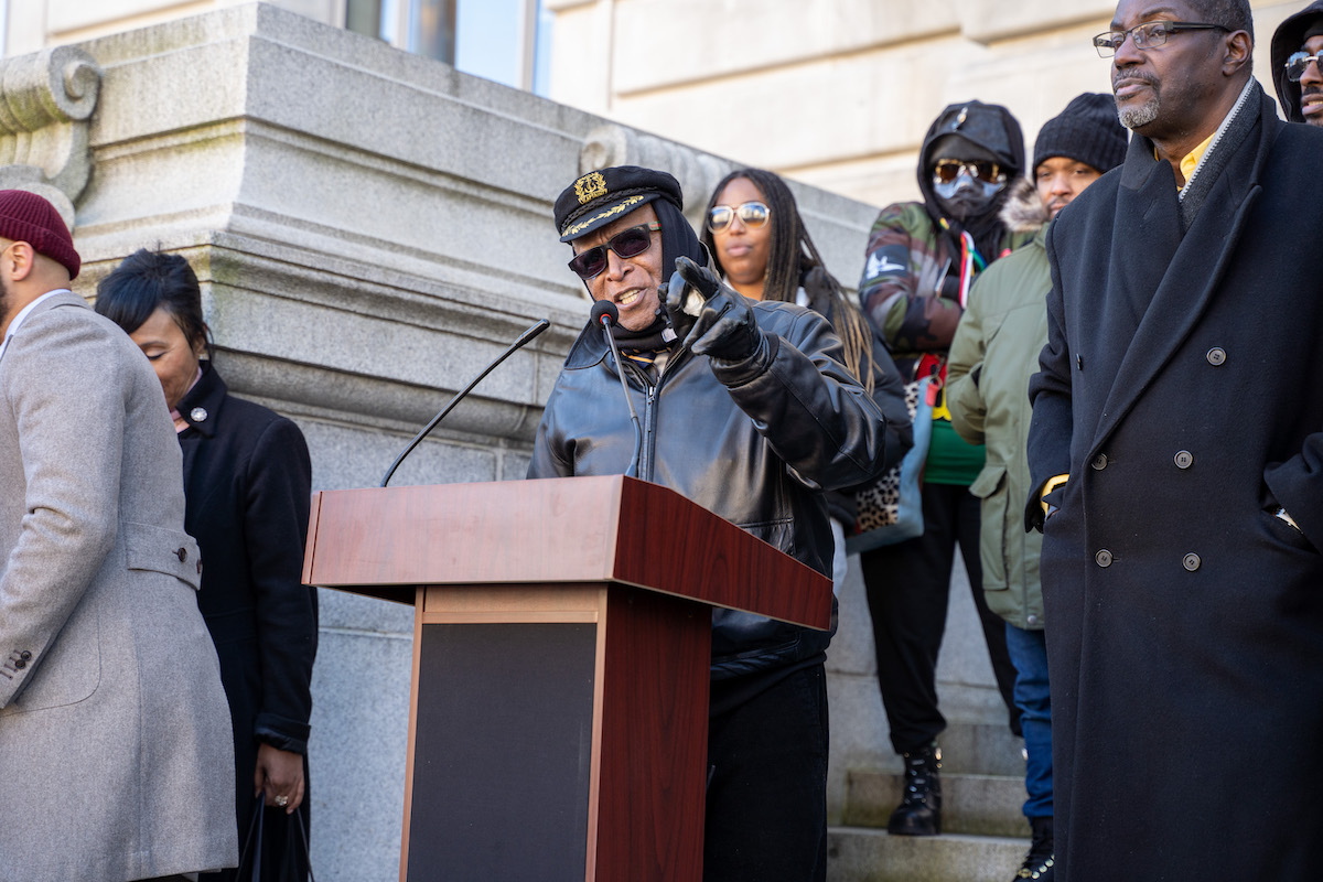 Roach Brown speaks in front of the John A. Wilson Building in D.C. during the Emergency Rally for Returning Citizens on Dec. 19. (Marckell Williams/The Washington Informer)