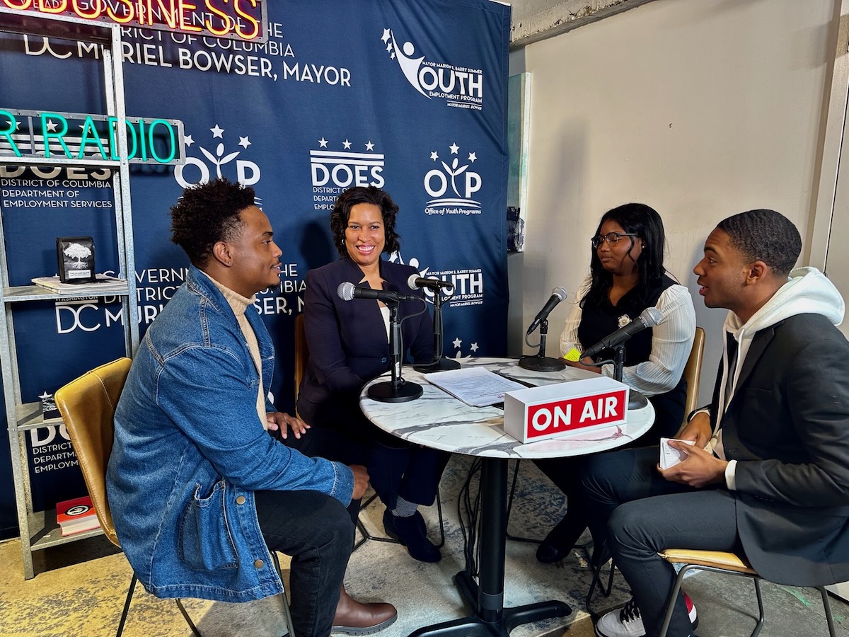 From right: Eric Curry III and Jessica Smith ask D.C. Mayor Muriel Bowser and Kevon King of Village Cafe DC questions during a livestream on Jan. 30. (Photo by Khalid Naji-Allah)
