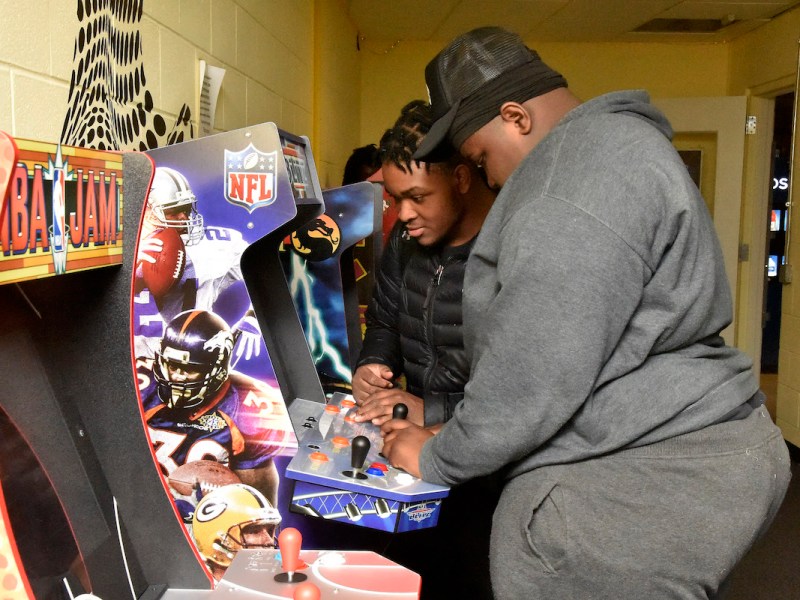 Taiden Myers (left) and Gabriel Perry counted among numerous teens who flocked to Esports Open Play at Raymond Recreation Center in northwest D.C. on Feb. 21 to showcase their skills on video game consoles and arcade machines. (Robert R. Roberts/The Washington Informer)