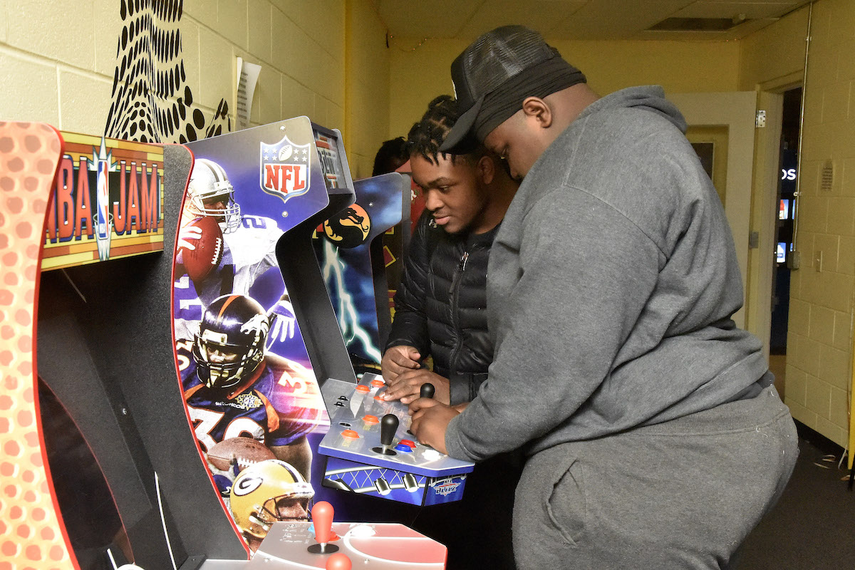 Taiden Myers (left) and Gabriel Perry counted among numerous teens who flocked to Esports Open Play at Raymond Recreation Center in northwest D.C. on Feb. 21 to showcase their skills on video game consoles and arcade machines. (Robert R. Roberts/The Washington Informer)