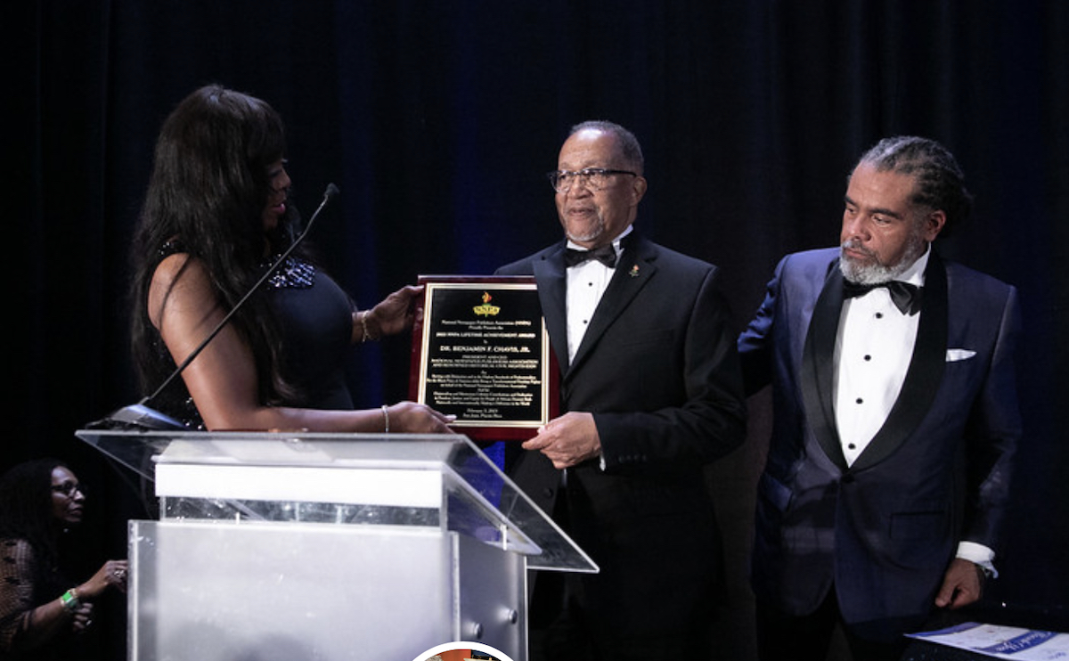 National Newspaper Publishers Association President and CEO Dr. Benjamin Chavis Jr. receives a lifetime achievement award at a birthday celebration during the organization's midwinter conference. (Courtesy of NNPA)