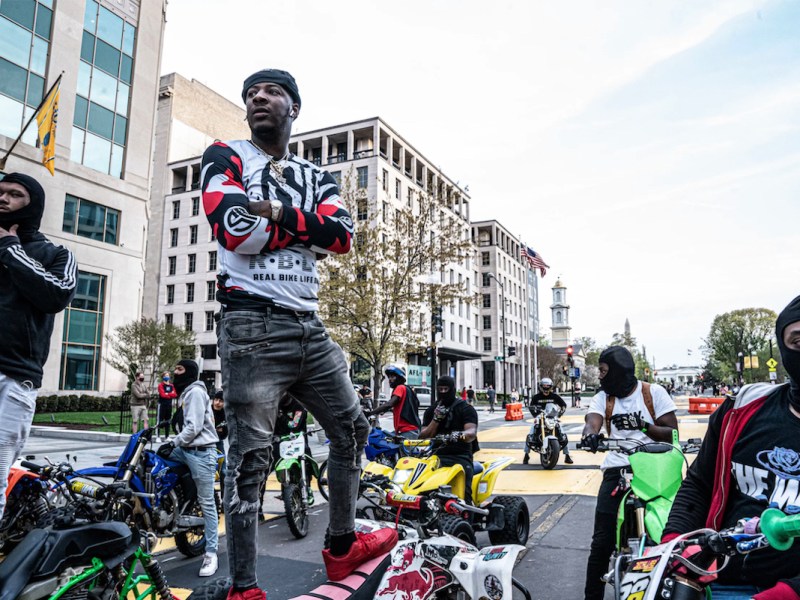Michael "Polo King" Roane (center) is a master rider from southeast Washington, D.C. He's highly respected within the bike life culture in multiple cities and countries. Roane describes the sport as a stress reliever from the realities of being Black in America. (Dee Dwyer)