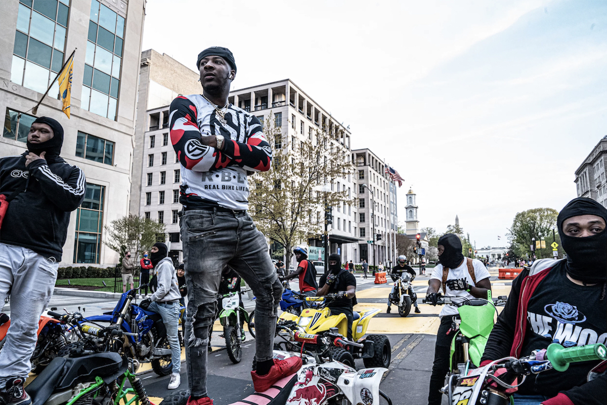 Michael "Polo King" Roane (center) is a master rider from southeast Washington, D.C. He's highly respected within the bike life culture in multiple cities and countries. Roane describes the sport as a stress reliever from the realities of being Black in America. (Dee Dwyer)