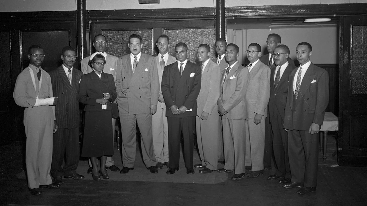 ​​In this 1950 photo by Paul Henderson, then-NAACP lawyer Thurgood Marshall (fifth from right) is shown with other civil rights activists, including future University of Maryland students Hiram Whittle (sixth from right) and Parren Mitchell (far right). (Courtesy of the Maryland Center for History and Culture)