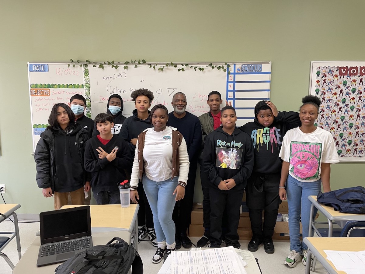 Tim Weedon (center), founder of Tech Turn Up, stands with middle school students at Cesar Chavez Public Charter School for Public Policy in northeast D.C. in January. This school year, he guided them in web development. Tech Turn Up counts among the many offerings featured at the "Summer in the City" event. (Courtesy photo)