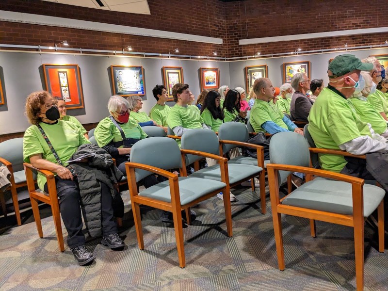Dozens of advocates wear neon green in support of Howard County's building electrification bill at a Feb. 23 hearing. (Courtesy of HoCo Climate Action)