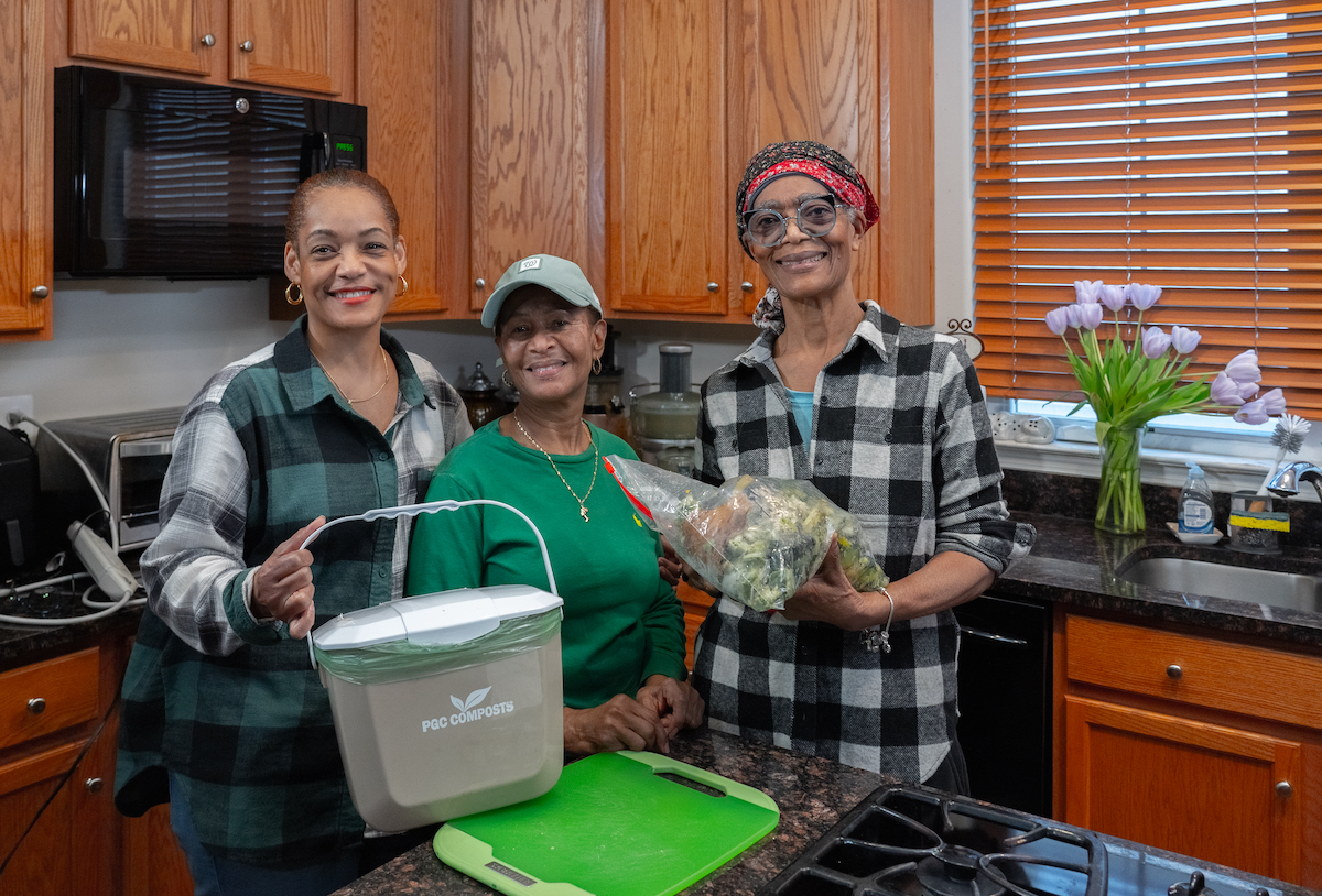 Prince George's County residents show off their curbside composting materials. (Courtesy of Prince George's County Department of the Environment)