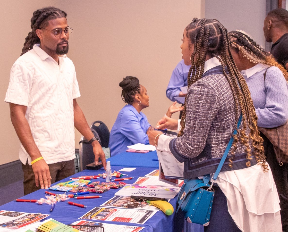 A resident speaks with a vendor at the Hack-A-Thon that took place on April 13 at the Walter E. Washington Convention Center. (Courtesy of Corryn St. Thomas, D.C. Department of Employment Services)